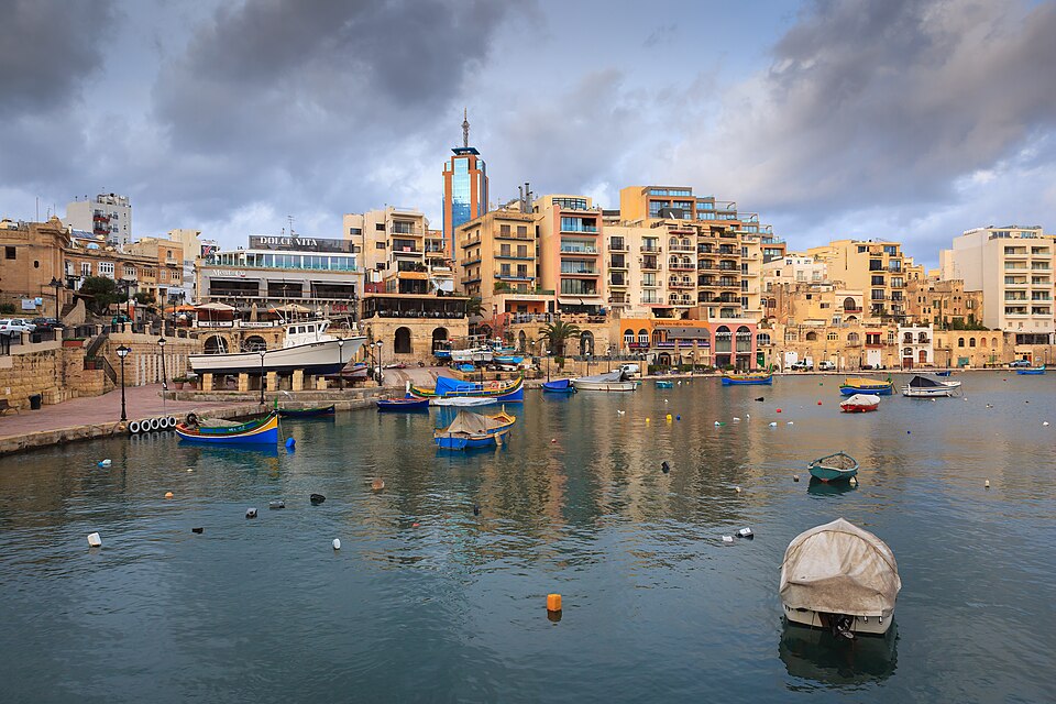 Spinola Bay in St Julian's with colourful waterfront buildings, Malta